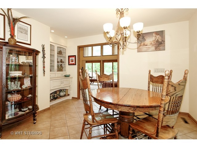 14511 Marengo Road Union, IL 60180 - Photo 8 of 25 a dining room with furniture and chandelier