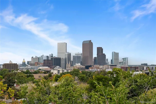 a view of a city with tall buildings in the background