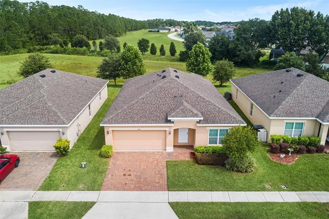 a view of house with garden space and street view