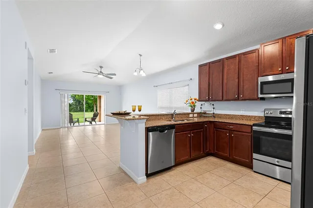a view of a bedroom with wooden floor