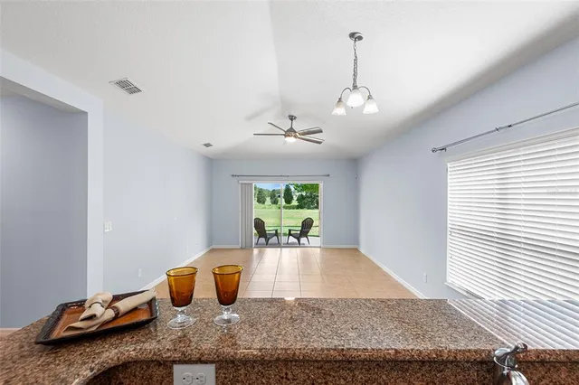 a living room with furniture a window and a table