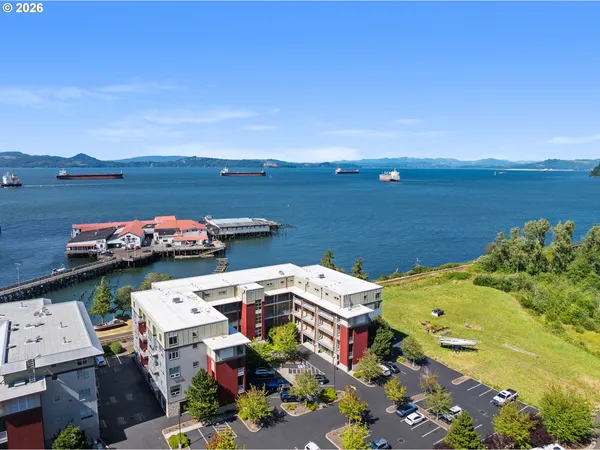 a buildings view with a lake view
