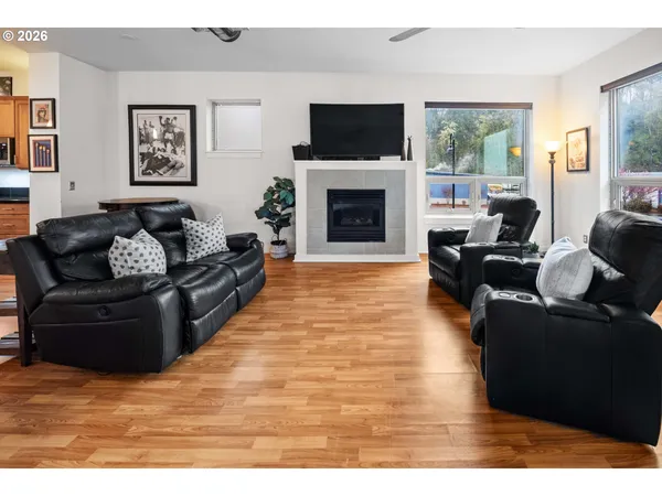 a living room with furniture fireplace and flat screen tv