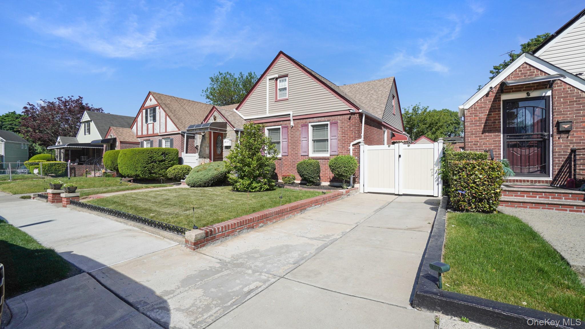 172-17 Amelia Road Queens, NY 11434 - Photo 2 of 18 a front view of a house with garden