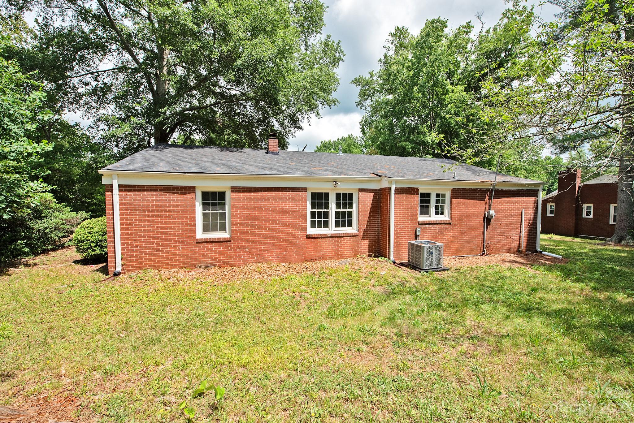 366 South Main Street Rutherfordton, NC 28139 - Photo 20 of 22 a front view of a house with a yard and garage