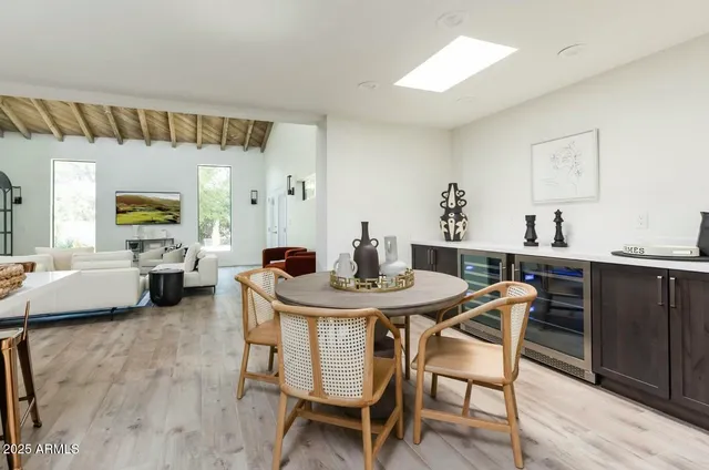 a large kitchen with a table and chairs