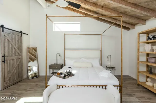 a bed room with a bed and a lamp
