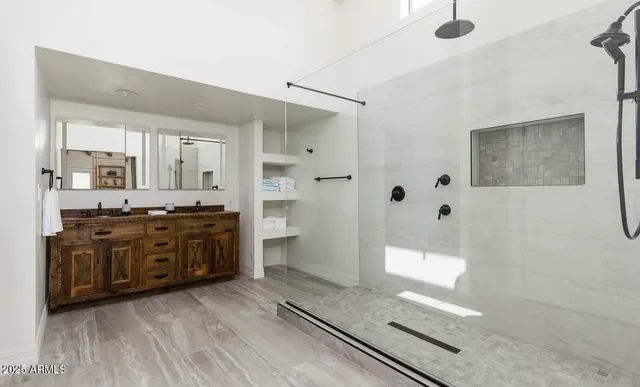 a bedroom with a bed and a lamp