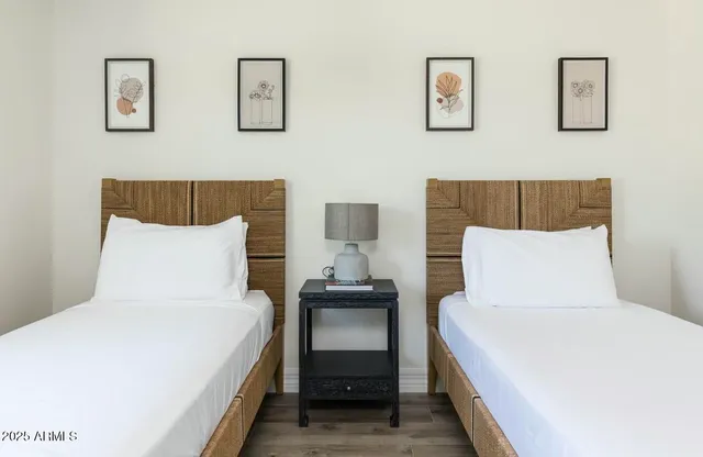 a view of a backyard with large trees