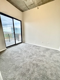 1464 South Michigan Avenue, Unit 1607 Chicago, IL 60605 - Photo 5 of 8 a view of an empty room with a window