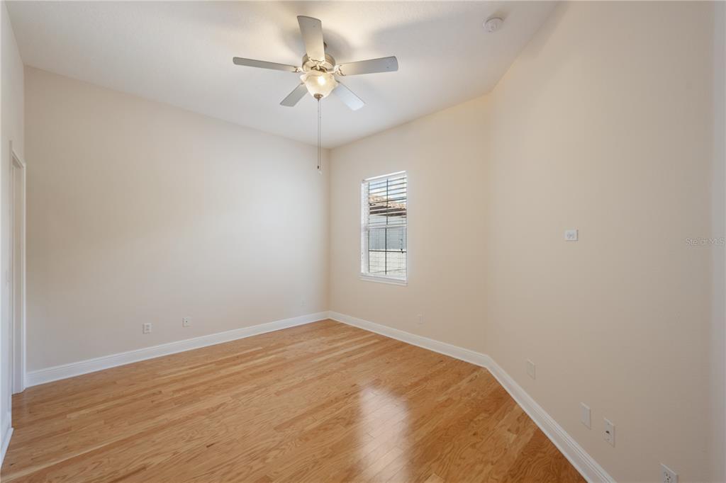 8119 Vía Rosa Orlando, FL 32836 - Photo 29 of 62 wooden floor in an empty room with a window