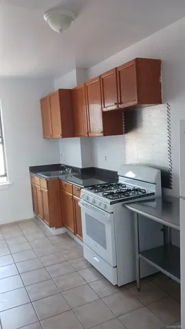 a kitchen with stainless steel appliances a stove a sink and a microwave