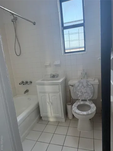 a bathroom with a sink a toilet and a bathtub