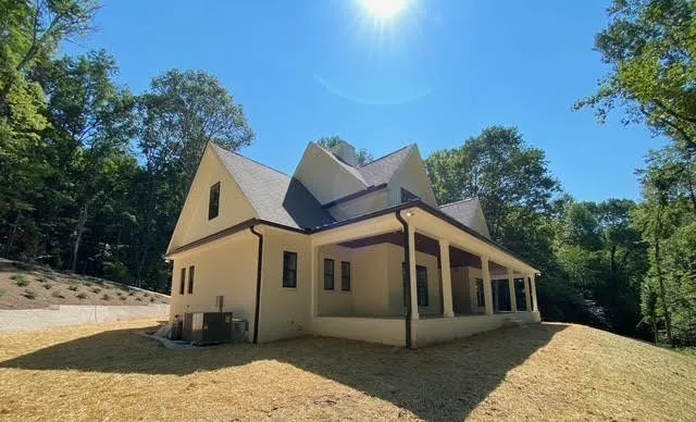 a view of a house with entrance door and garden