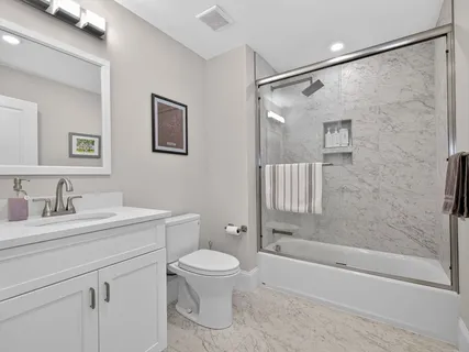 a bathroom with a toilet sink and a bathtub