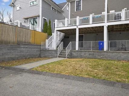 a house with swimming pool in front of it