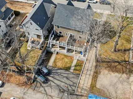 an aerial view of residential houses with outdoor space