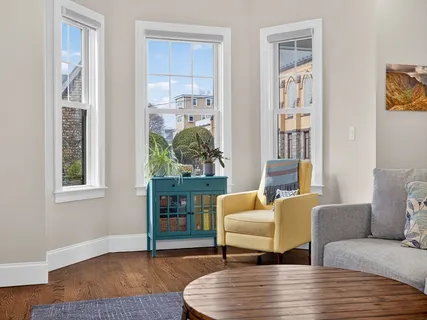 a living room with furniture and a window