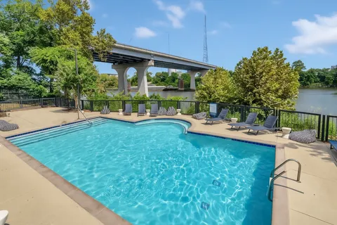 a view of a terrace with a bench and potted plants