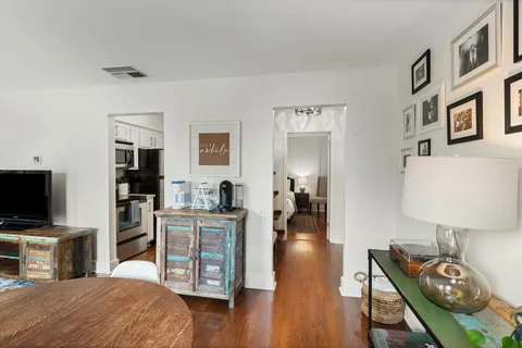 a bedroom with furniture and a flat screen tv