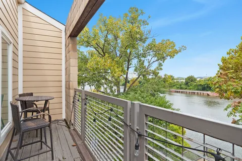 a view of a balcony with chairs