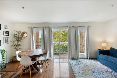 a view of a livingroom with furniture and a window