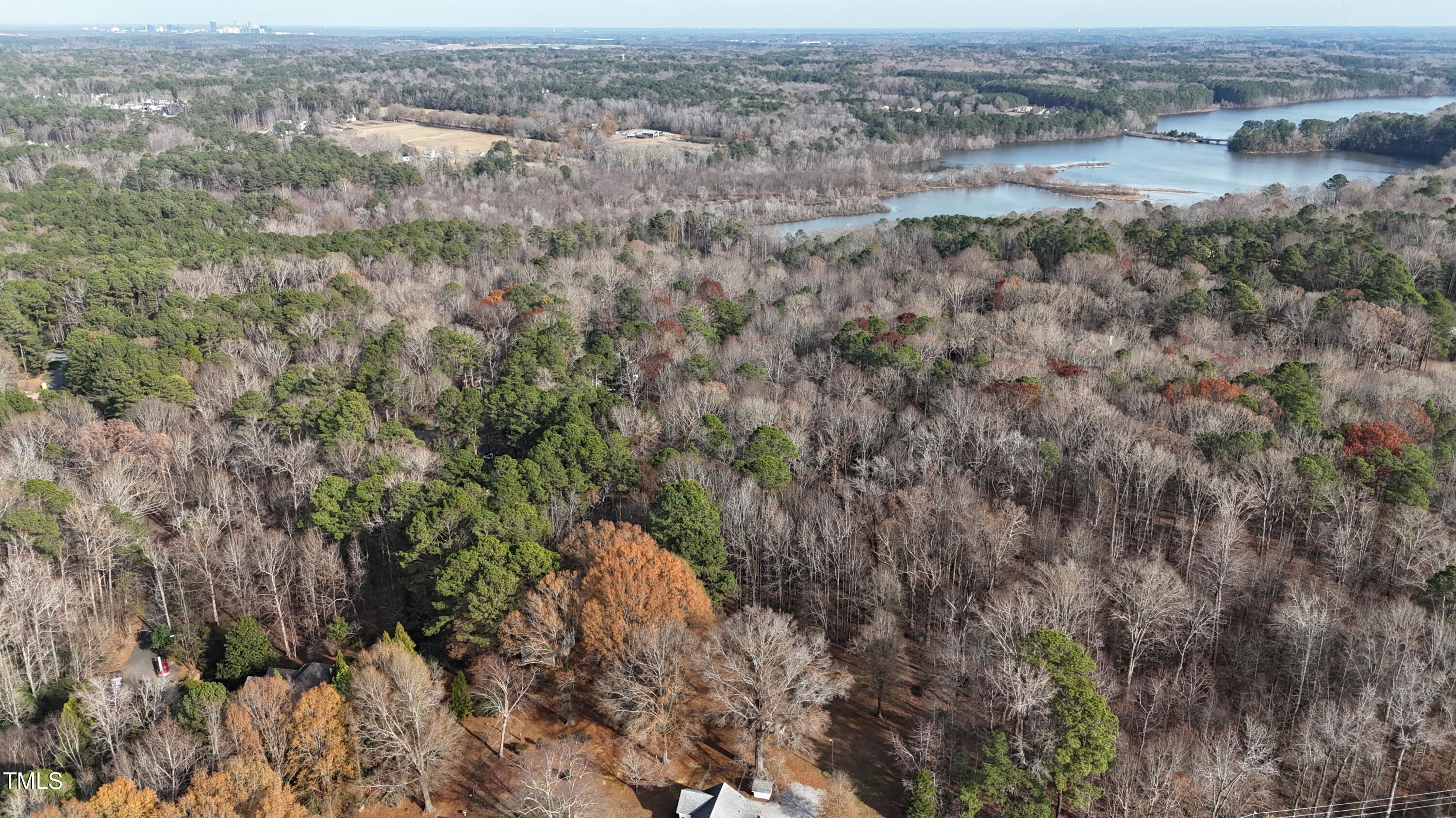 8012 Penny Road Raleigh, NC 27606 - Photo 6 of 11 an aerial view of house with yard and mountain in the background