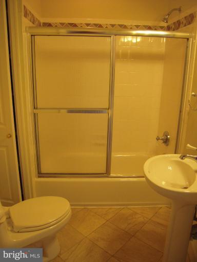1346 Spring Road Northwest Washington, DC 20010 - Photo 15 of 30 a bathroom with a shower and a toilet