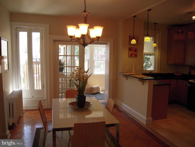 1346 Spring Road Northwest Washington, DC 20010 - Photo 18 of 30 a view of a dining room with furniture window and wooden floor