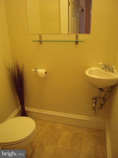 1346 Spring Road Northwest Washington, DC 20010 - Photo 20 of 30 a bathroom with a sink and a toilet