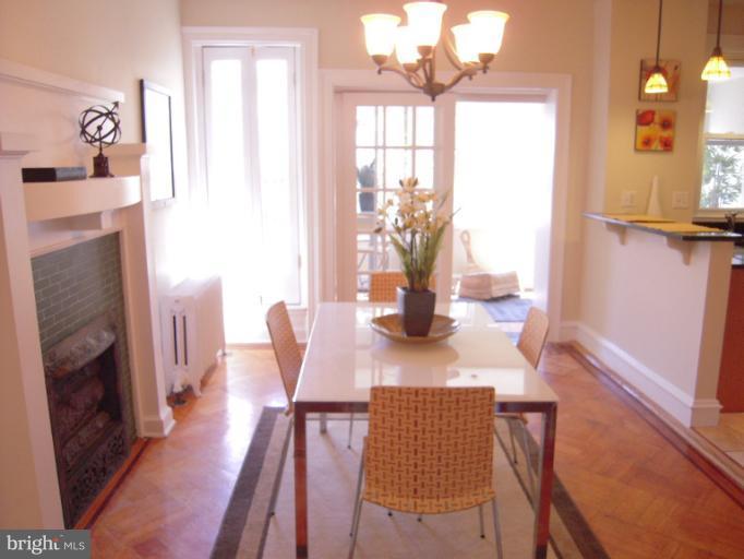 1346 Spring Road Northwest Washington, DC 20010 - Photo 22 of 30 a view of a dining room with furniture and wooden floor