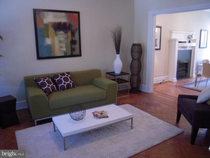 1346 Spring Road Northwest Washington, DC 20010 - Photo 29 of 30 a living room with furniture and wooden floor