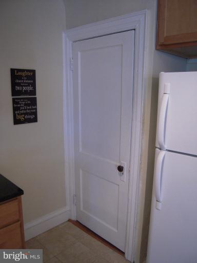 1346 Spring Road Northwest Washington, DC 20010 - Photo 4 of 30 a view of hallway with refrigerator