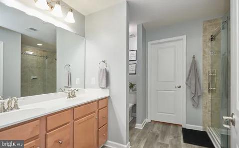2301 Harmsworth Drive Dumfries, VA 22026 - Photo 8 of 18 a bathroom with a double vanity sink mirror and shower