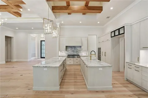 a view of living room with granite countertop furniture and a fireplace