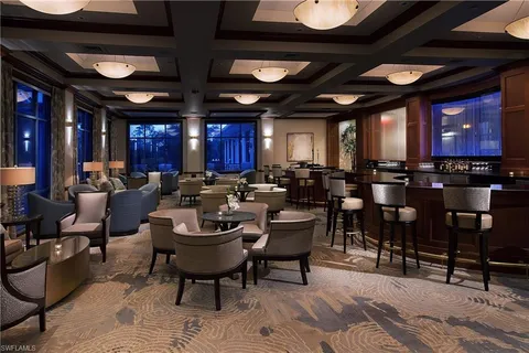 a view of a house with swimming pool and garden