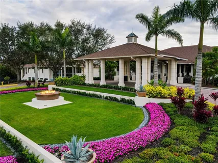 a view of a swimming pool with seating area