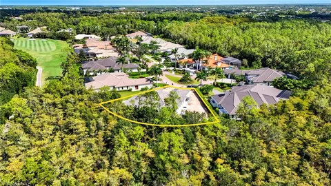 a view of a houses with a lush green forest