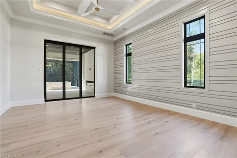 a bathroom with a granite countertop toilet and sink