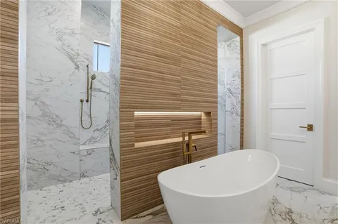 a bathroom with a sink a mirror and a shower