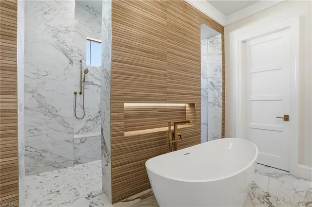 a bathroom with a sink a mirror and a shower