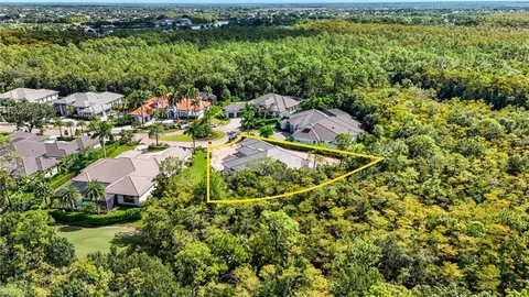 an aerial view of residential house with outdoor space and swimming pool