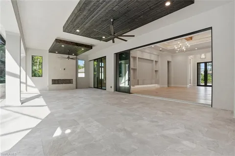 a view of a room with wooden floor and windows