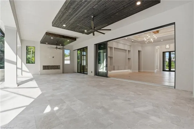 a view of a room with wooden floor and windows