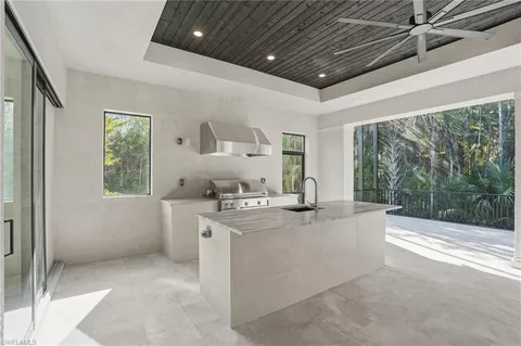 a view of a livingroom with wooden floor and windows