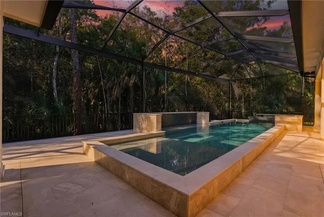 a spacious bathroom with a granite countertop sink and a large mirror