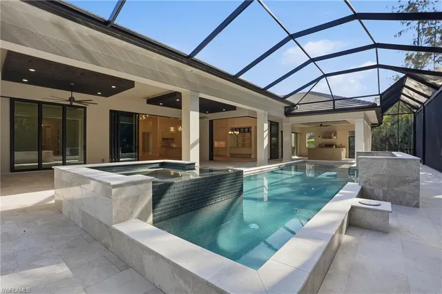 a view of a backyard with swimming pool