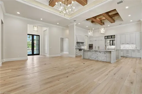 a view of kitchen with cabinets and wooden floor