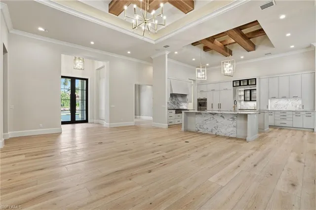 a view of kitchen with cabinets and wooden floor