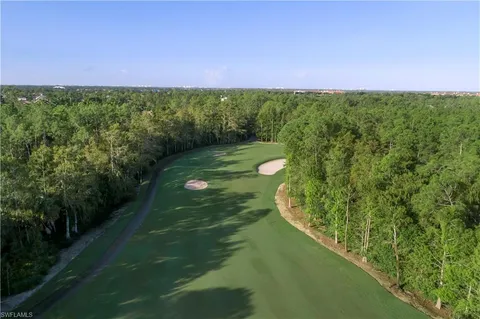a view of a swimming pool and a yard